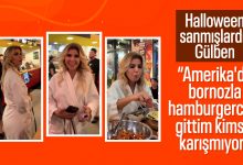 Gülben Ergen Amerikada bornozuyla bir hamburgerciye giderken gülümsüyor